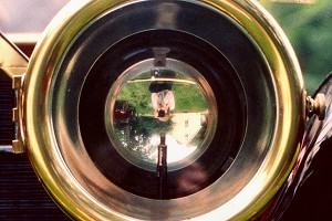 Reflection in antique automobile headlight, Whately, MA - July, 2000