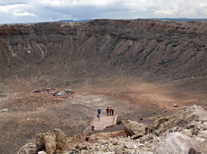 Visitors dwarfed by crater